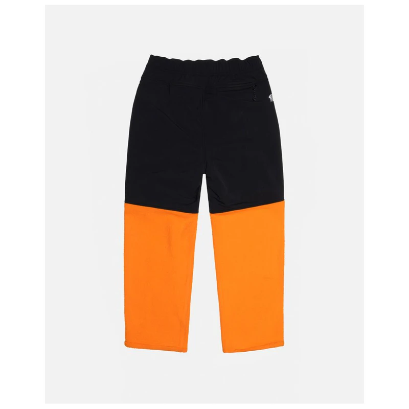 Mountain Hardwear MHW X Stüssy Trousers (Alpin Orange) | Sportpursuit.